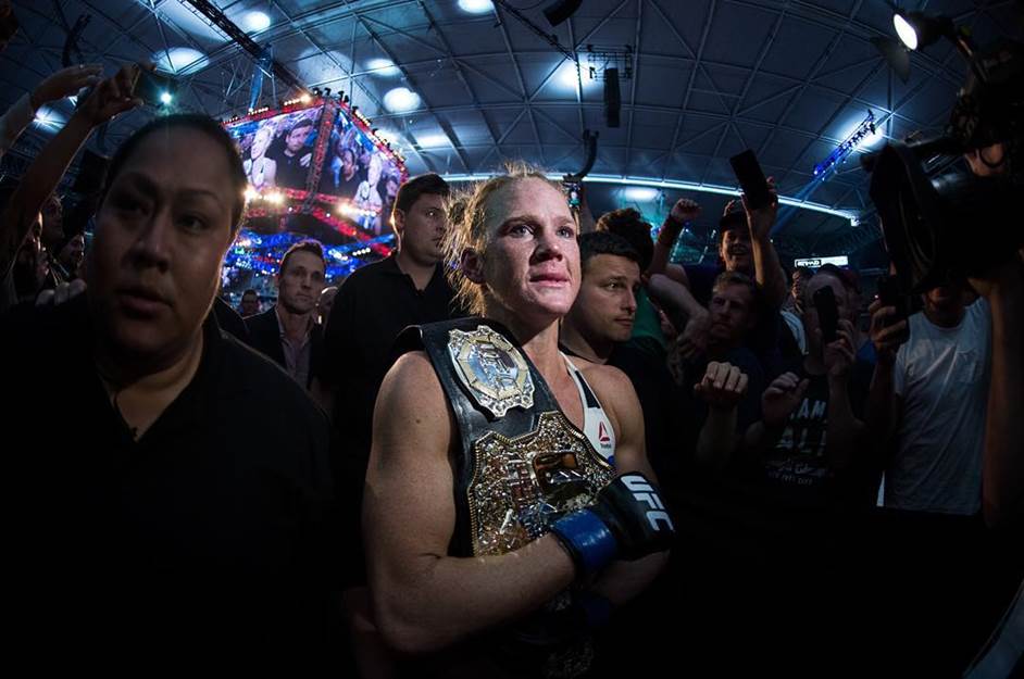 HolmWins - MyMMANews Holly Holm walks to the back after knocking out Ronda Rousey in epic fashion to win the women's bantamweight title at UFC 190 in Melbourne, Australia.