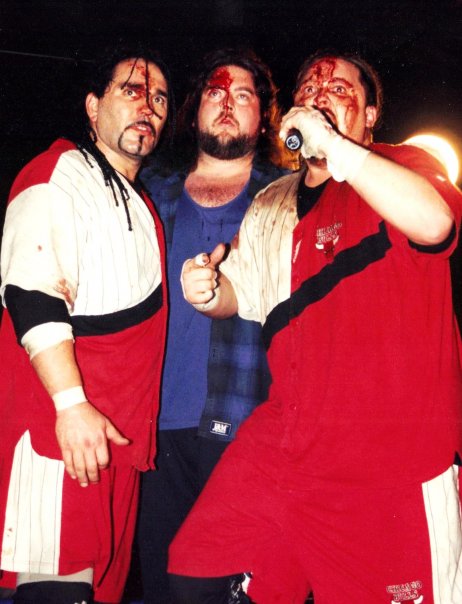 Doug Yasinsky (middle) with Public Enemy at an ECW event