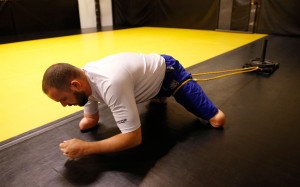 Joey Bozik pulls weights during a drill to increase strength in his hips.