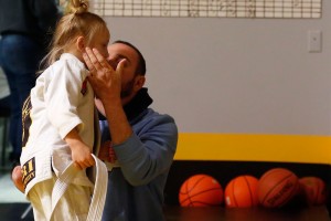 Joey Bozik kisses his daugher, Violet Bozik, after her training session at Tier 1 in McKinney.