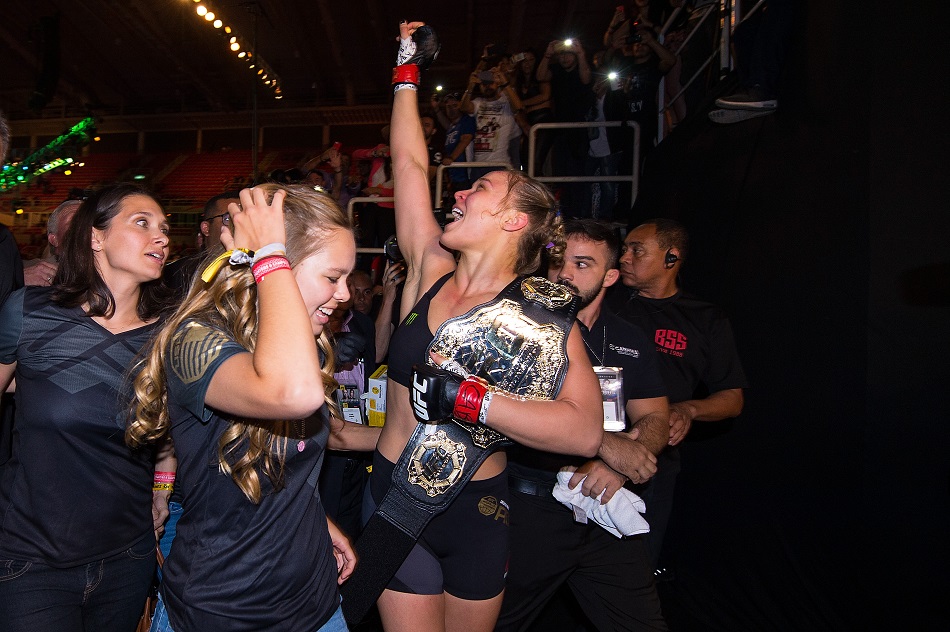 RIO DE JANEIRO, BRAZIL - AUGUST 01: UFC women's bantamweight champion Ronda Rousey celebrates with her family and fans backstage after defeating Bethe Correira of Brazil by KO during the UFC 190 event inside HSBC Arena on August 1, 2015 in Rio de Janeiro, Brazil. (Photo by Jeff Bottari/Zuffa LLC/Zuffa LLC via Getty Images)