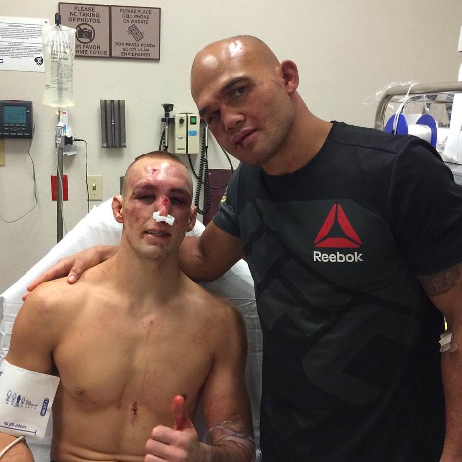 UFC welterweight champion Robbie Lawler and Rory MacDonald pose for a picture at the hospital after their UFC 189 fight of the year at the MGM Grand Garden Arena.