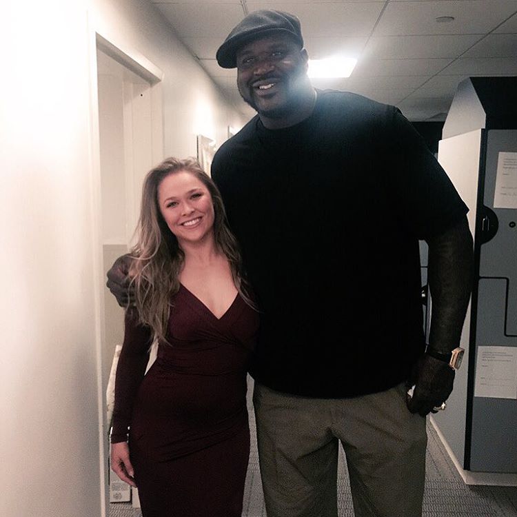 Former UFC women's bantamweight champion Ronda Rousey poses for a picture backstage at Live with Kelly and Michael with four-time NBA world champion Shaquille O'Neal.