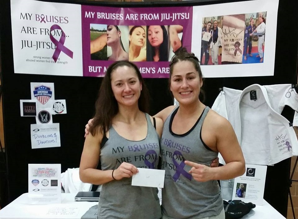 Jessica Eye (right) donates her grappling tournament winnings to "My Bruises Are From Jiu Jitsu"