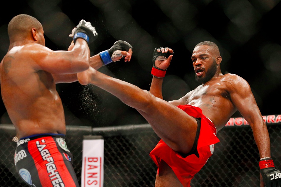 Jon Jones kicks Daniel Cormier during their light heavyweight title bout at UFC 182 in January. Photo: AP