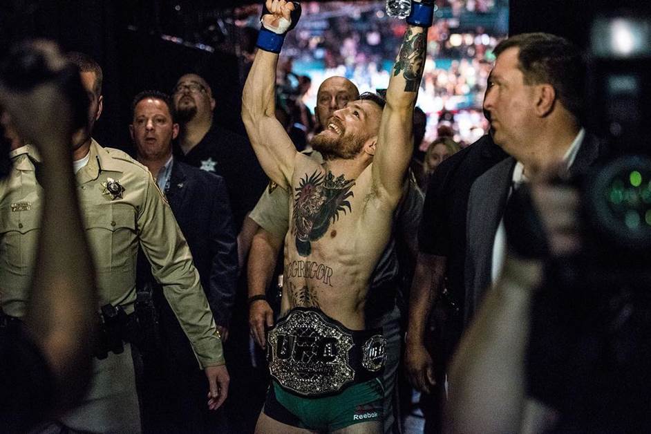 UFC featherweight champion Conor McGregor celebrates after his victory over former longtime champion Jose Aldo at UFC 194 at MGM Grand in Las Vegas