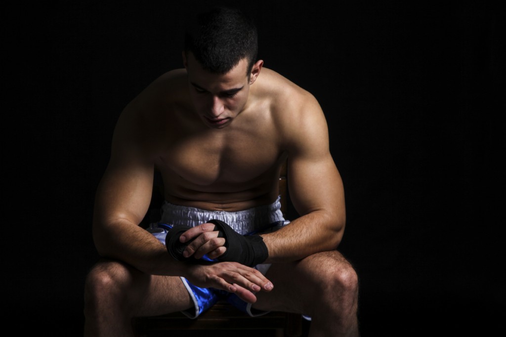 Muscular boxer preparing for battle