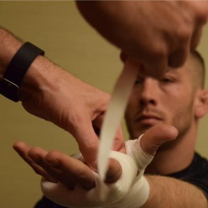 Paul Querido wraps the hands of Scott "The Animal" Heckman