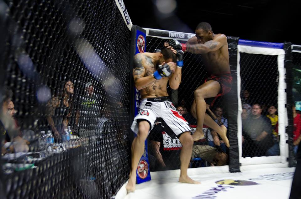 Nah-Shon Burrell lands a flying knee at GPG 24 - Photo by Lance Stein